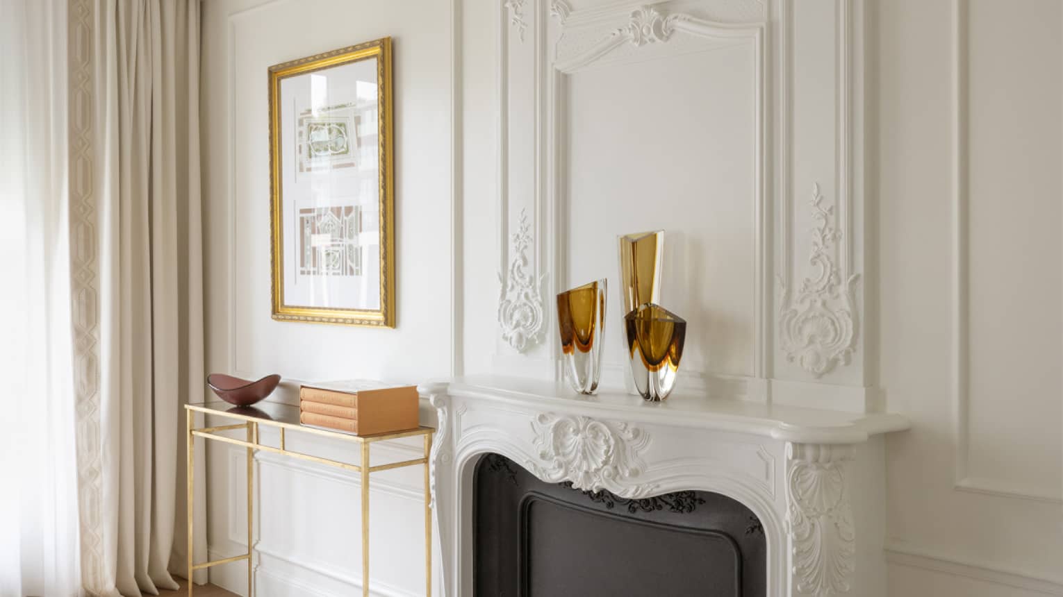Grand Premier Suite living room with fireplace and crown molding at Four Seasons Hotel George V, Paris