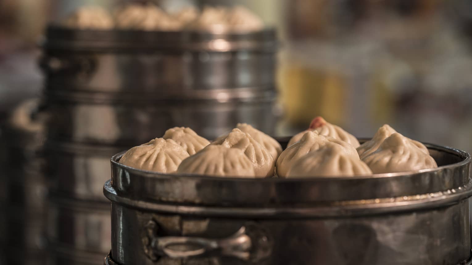 Tianjin steamed buns in metal steam baskets