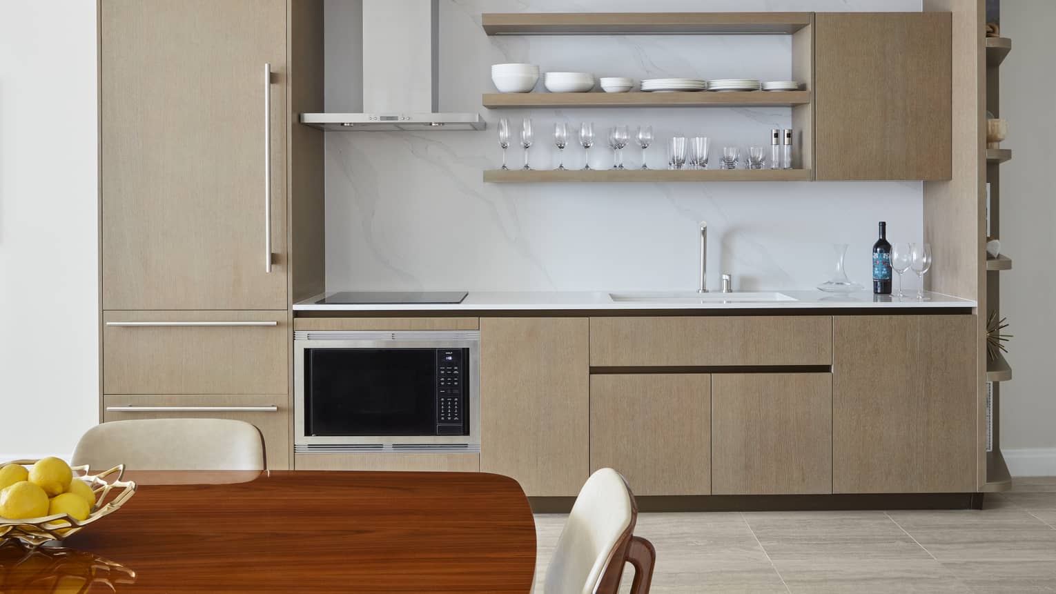 Kitchen with fridge, oven, sink and open shelves