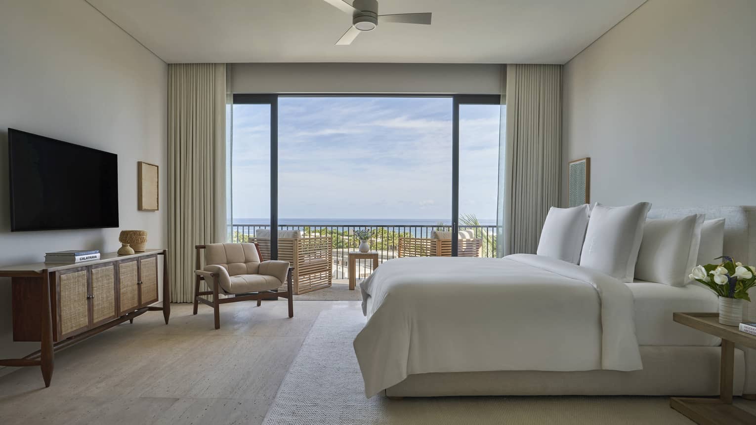 Private villa bedroom with king bed and soothing interiors with private terrace at Four Seasons Resort and Residences Los Cabos