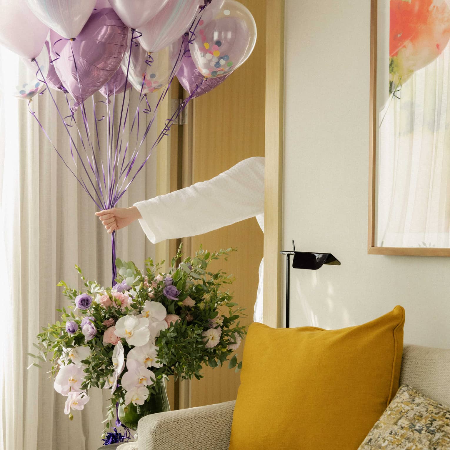 Guest room decorated with flowers and balloons