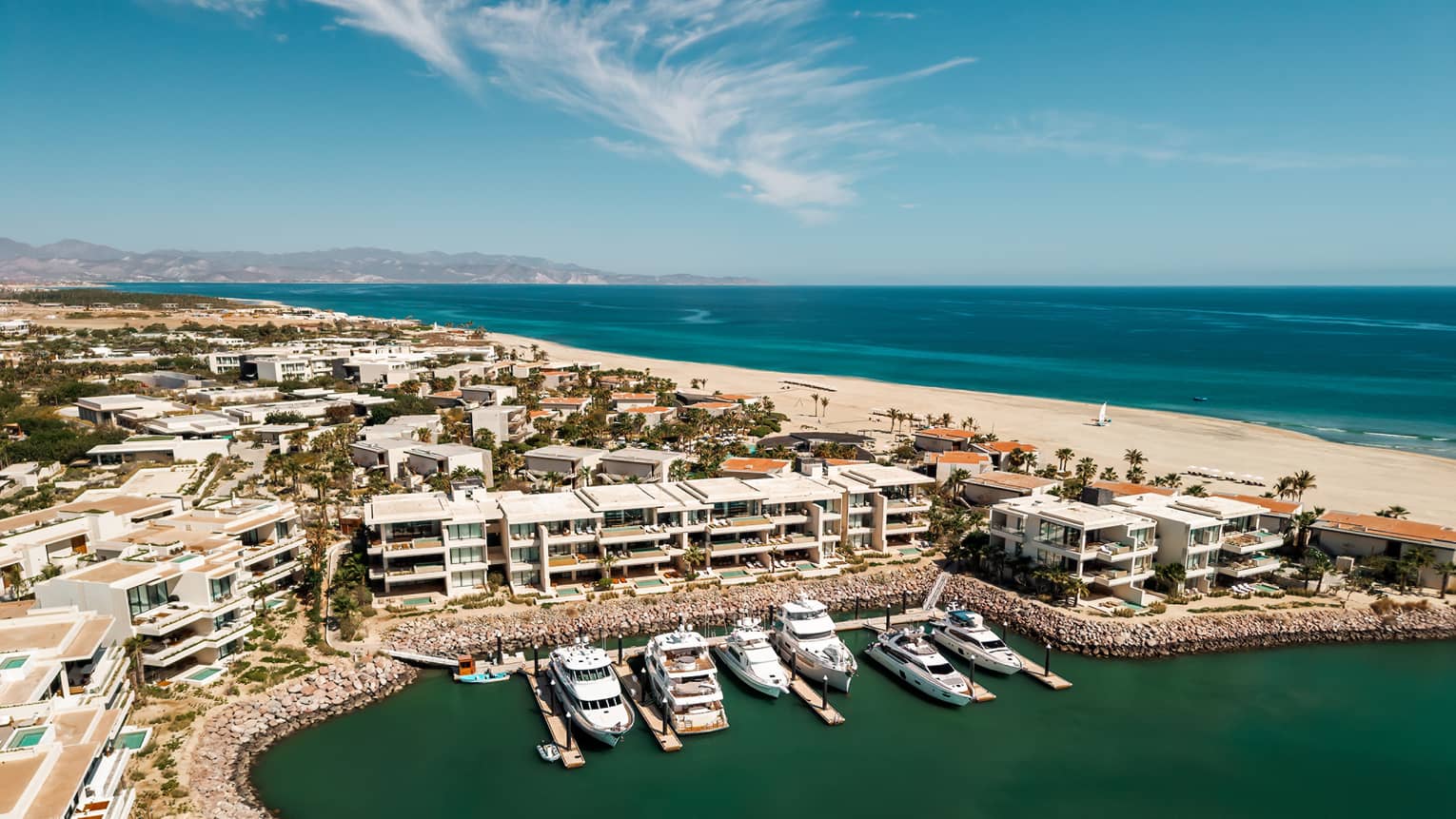 Aerial view of marina and beach in the distance