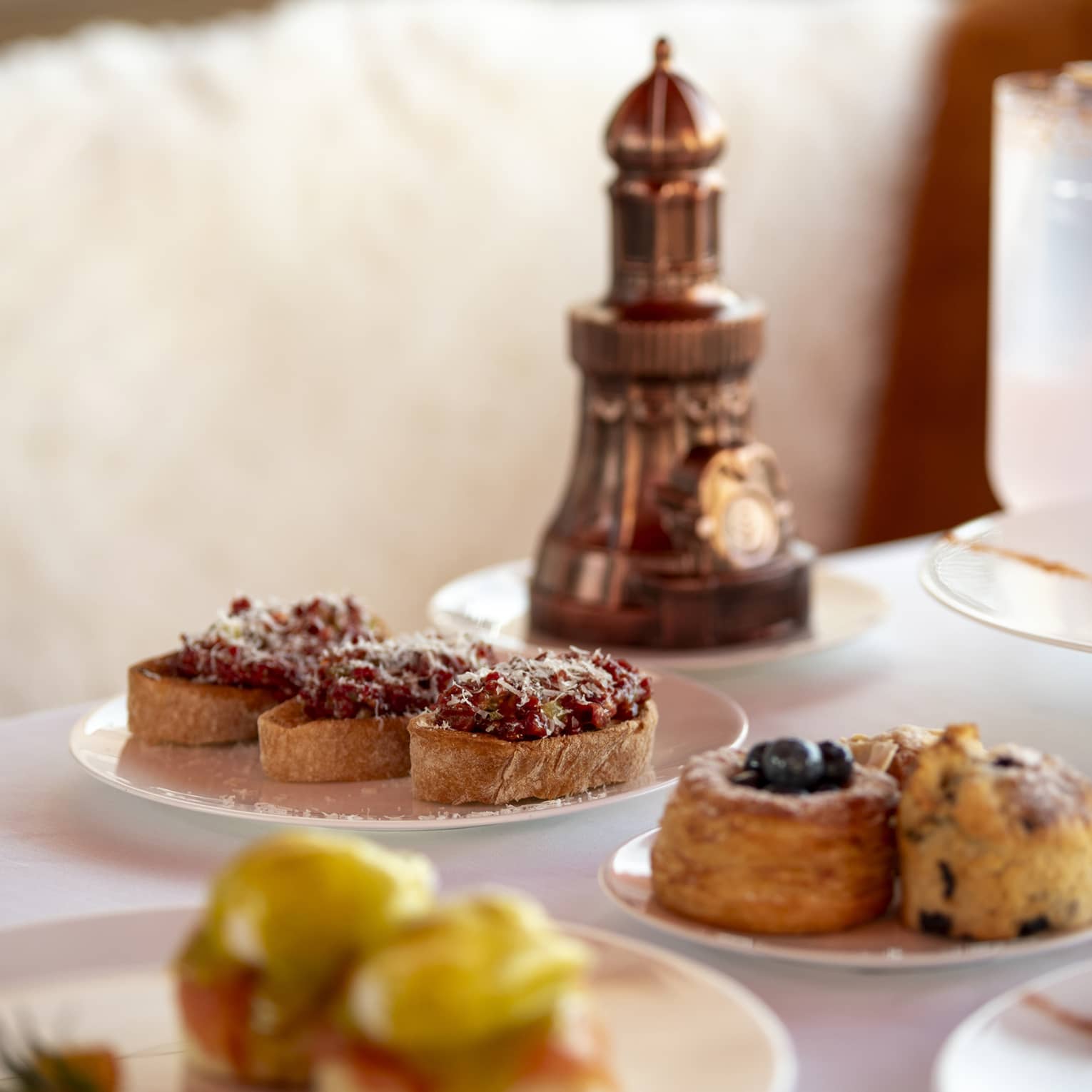 Plates of pastries on dining table