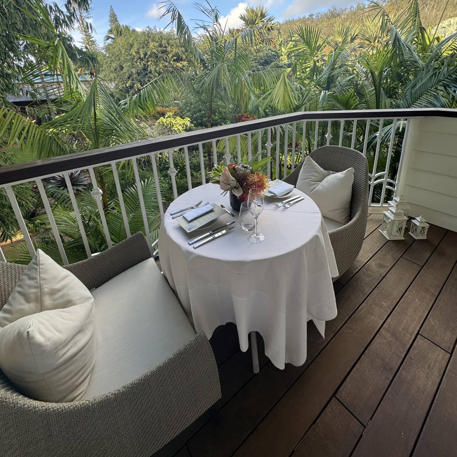 Outdoor private dining on a patio with a view of green tees.