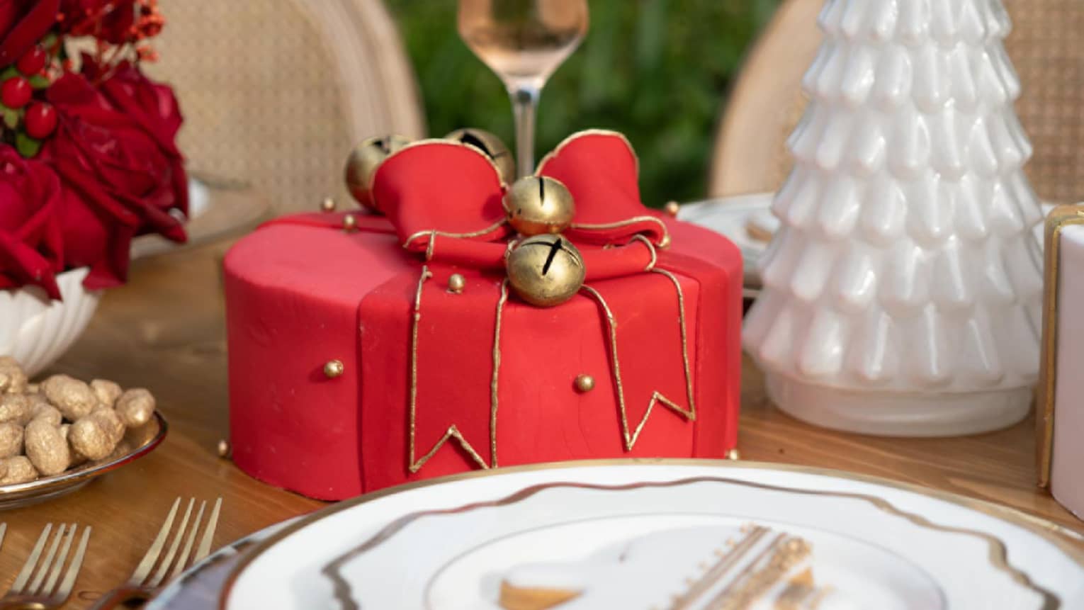 Red cake made to look like a present with a ribbon on top