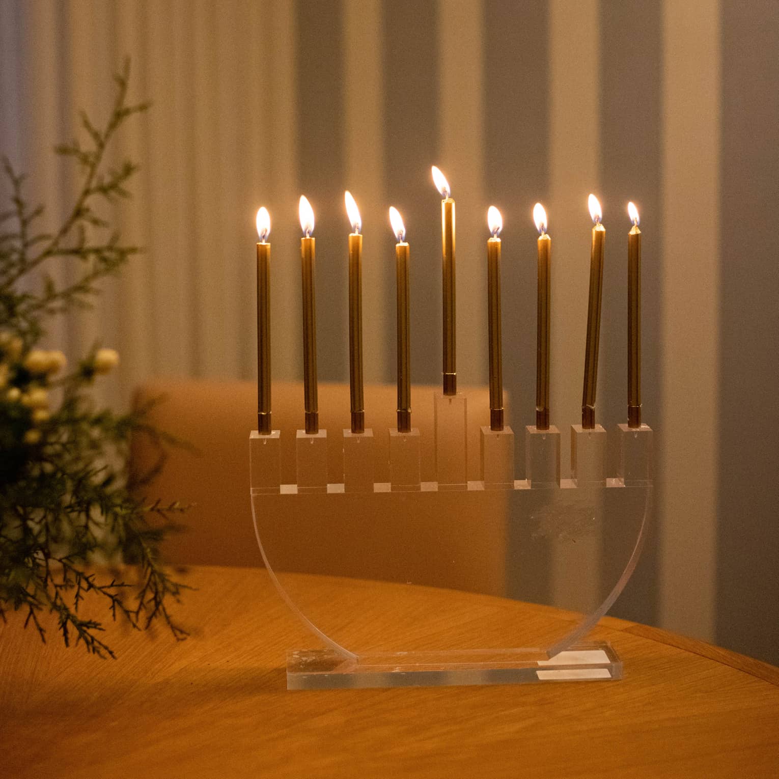 A menorah on a wood table.
