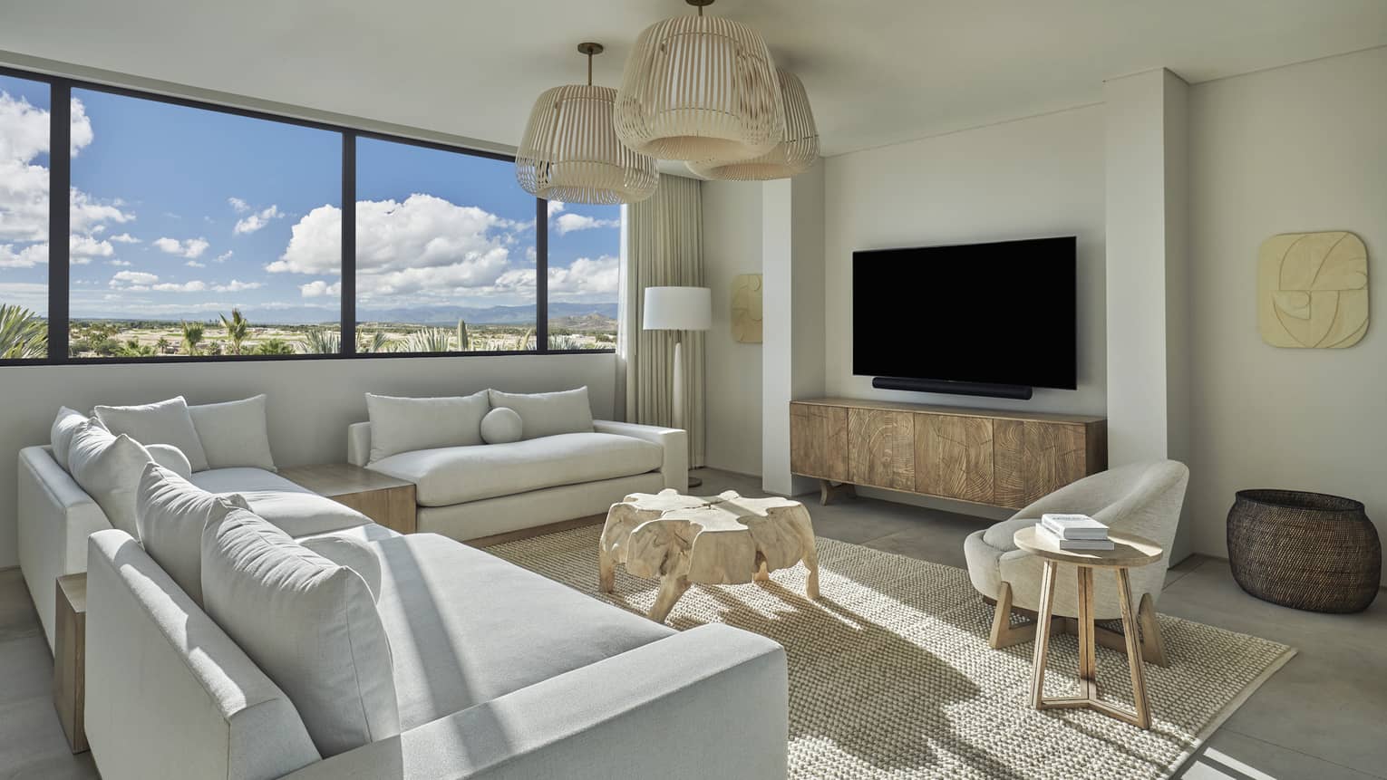 Light-filled living room with three small sofas forming a sectional sofa