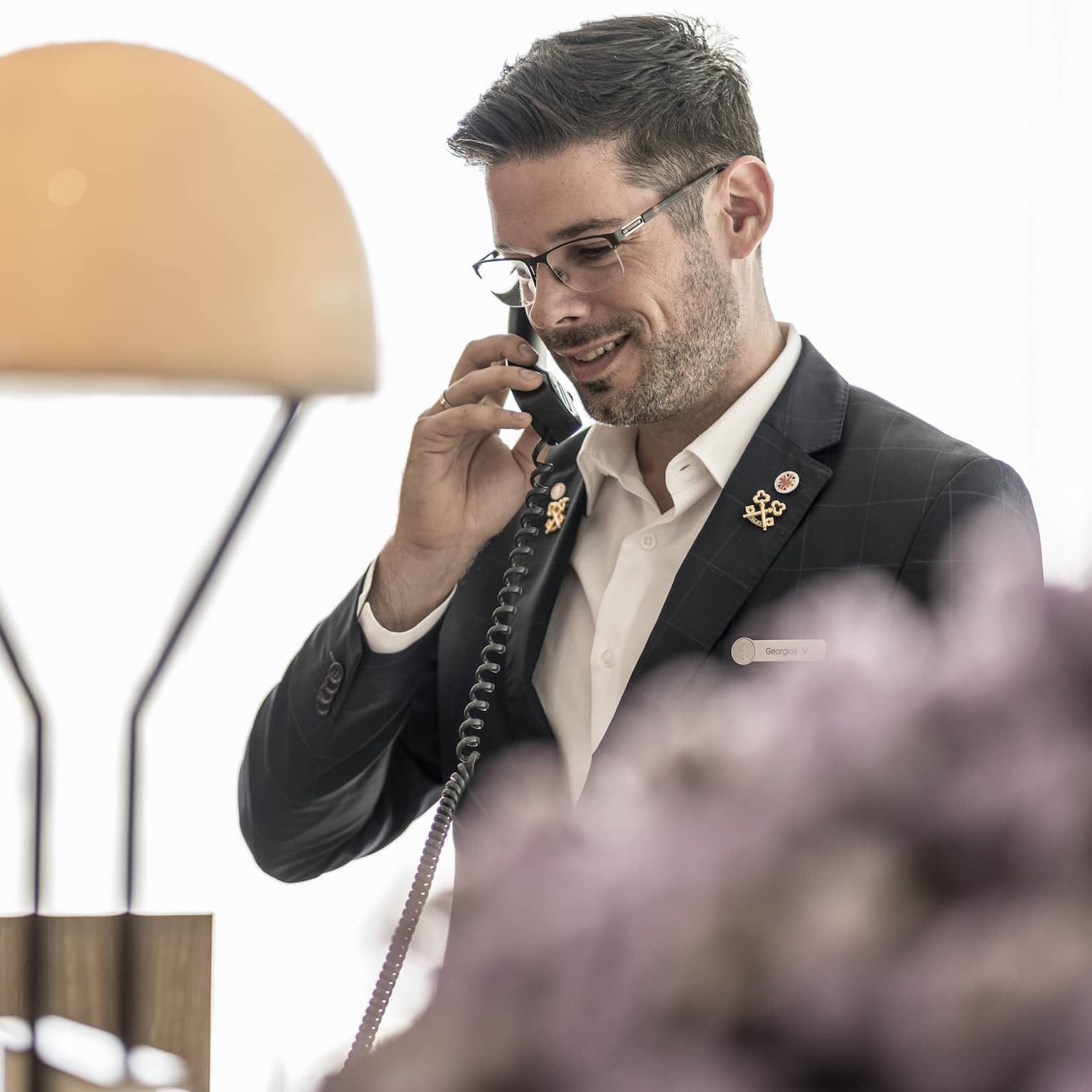 The concierge happily assists guests over the phone