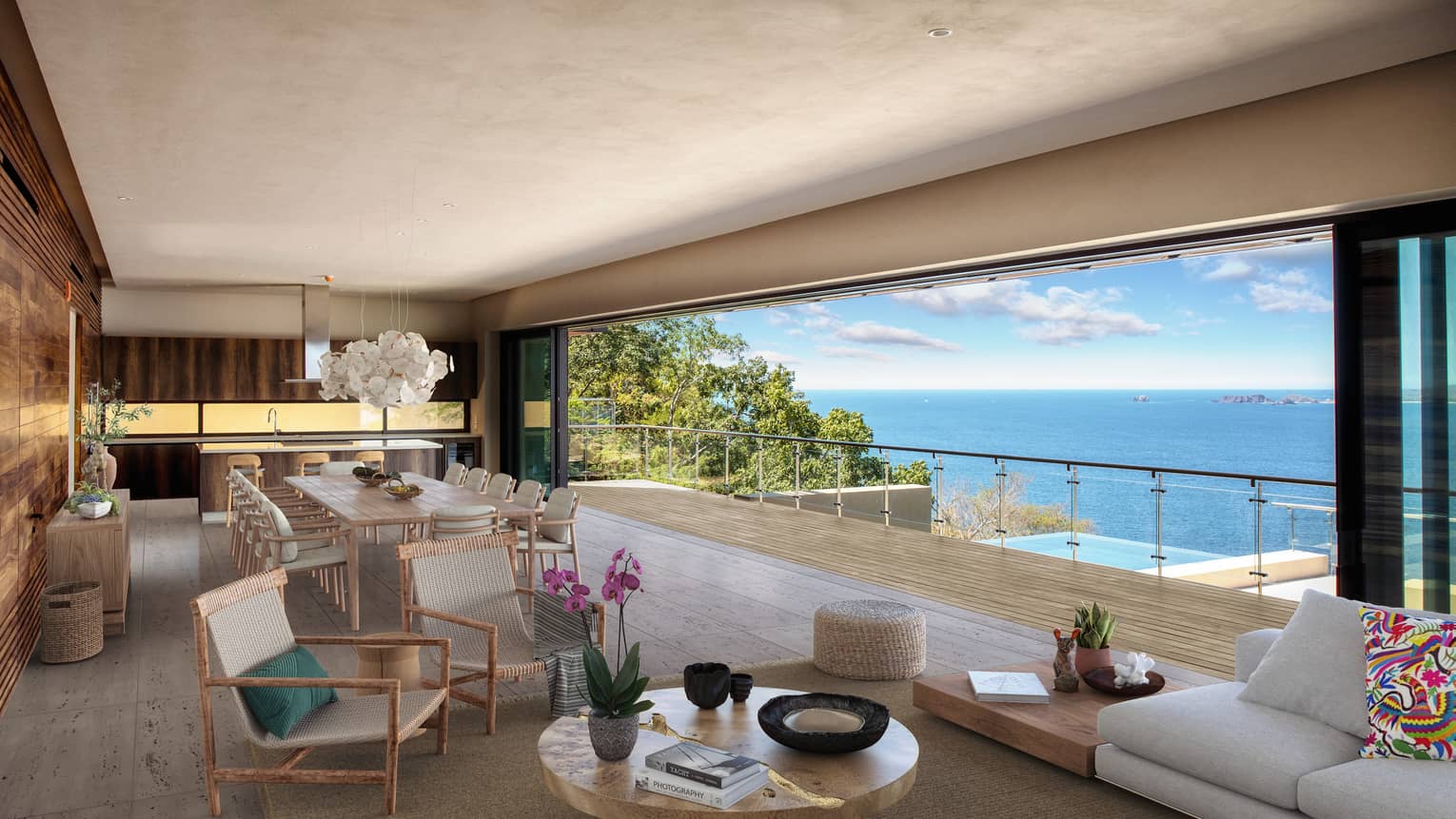 View of living room with open-air view of terrace and ocean