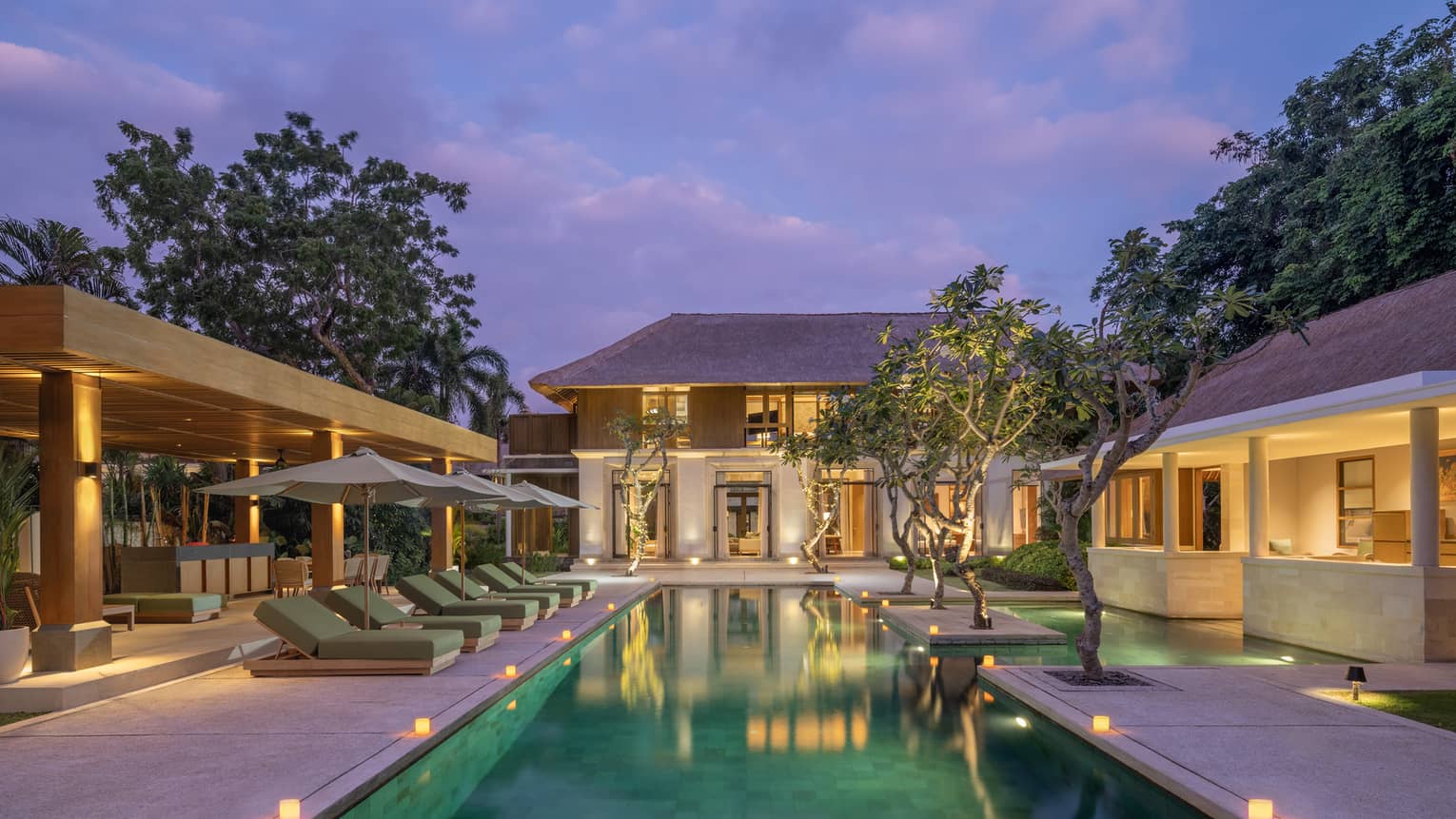 Pool and view of Four-Bedroom Premier Residence at dusk