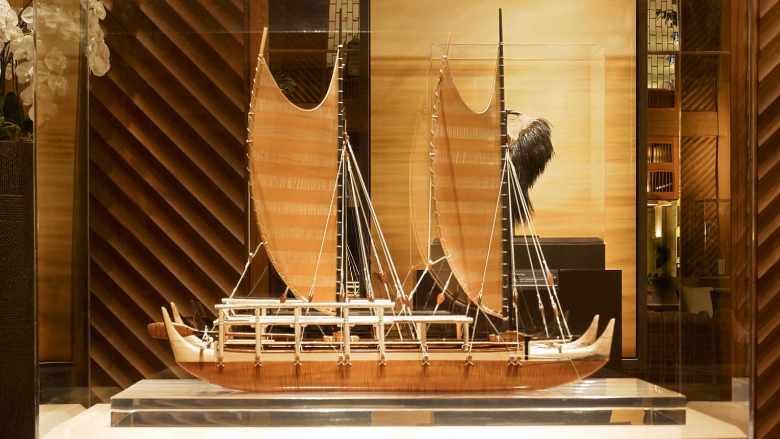 A sculpture of a boat in Four Seasons Resort Lanai's lobby