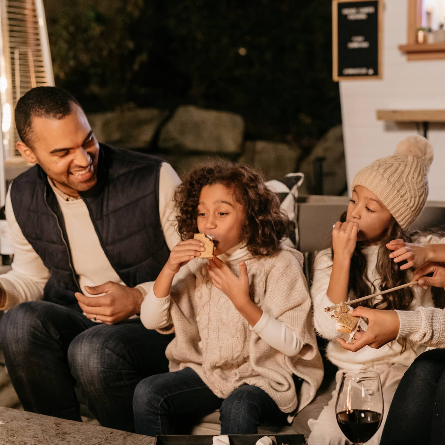 A family enjoying snacks and drinks.