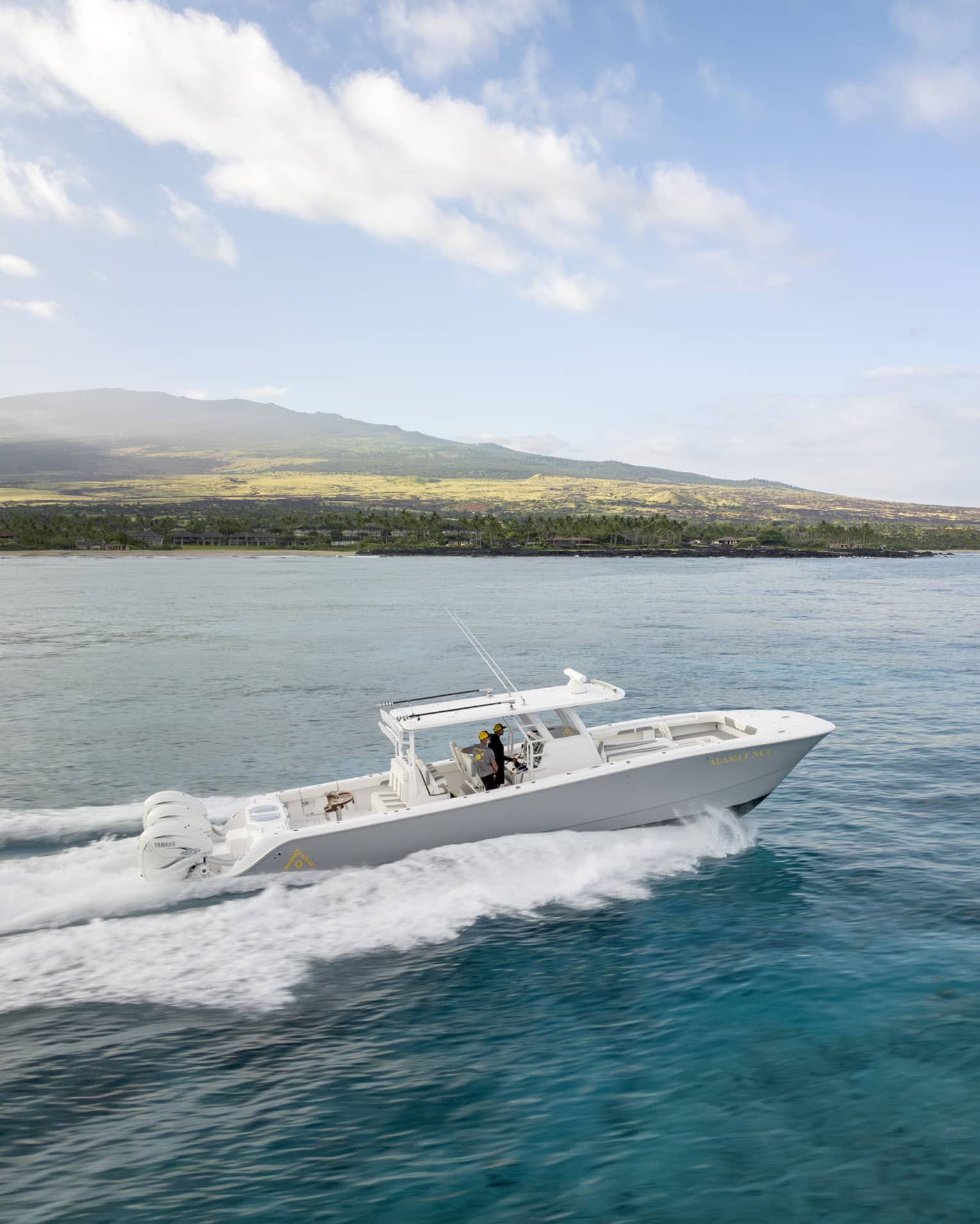 Boat on the water along Hawaii Island coast