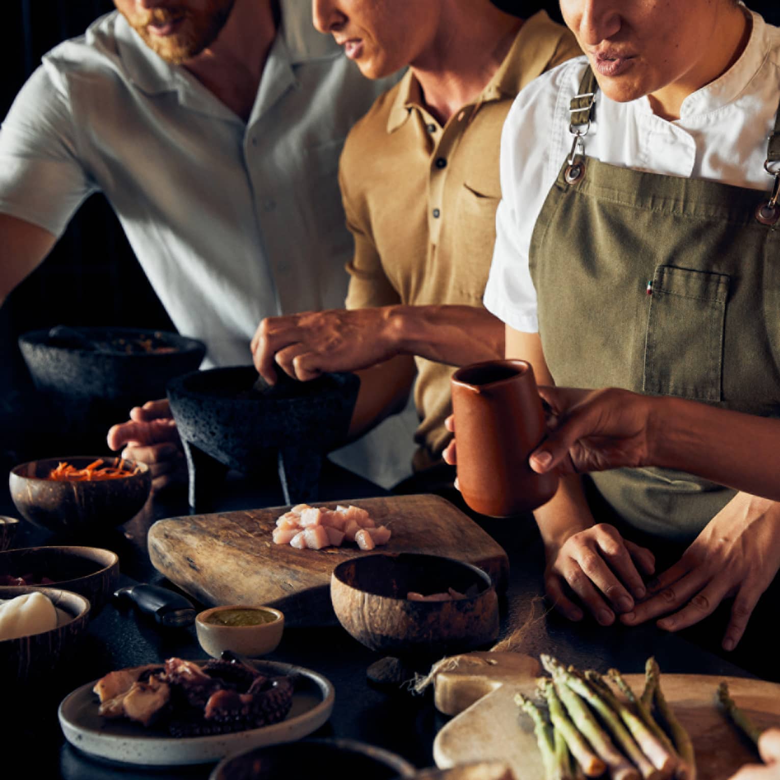 A group of people cooking food.