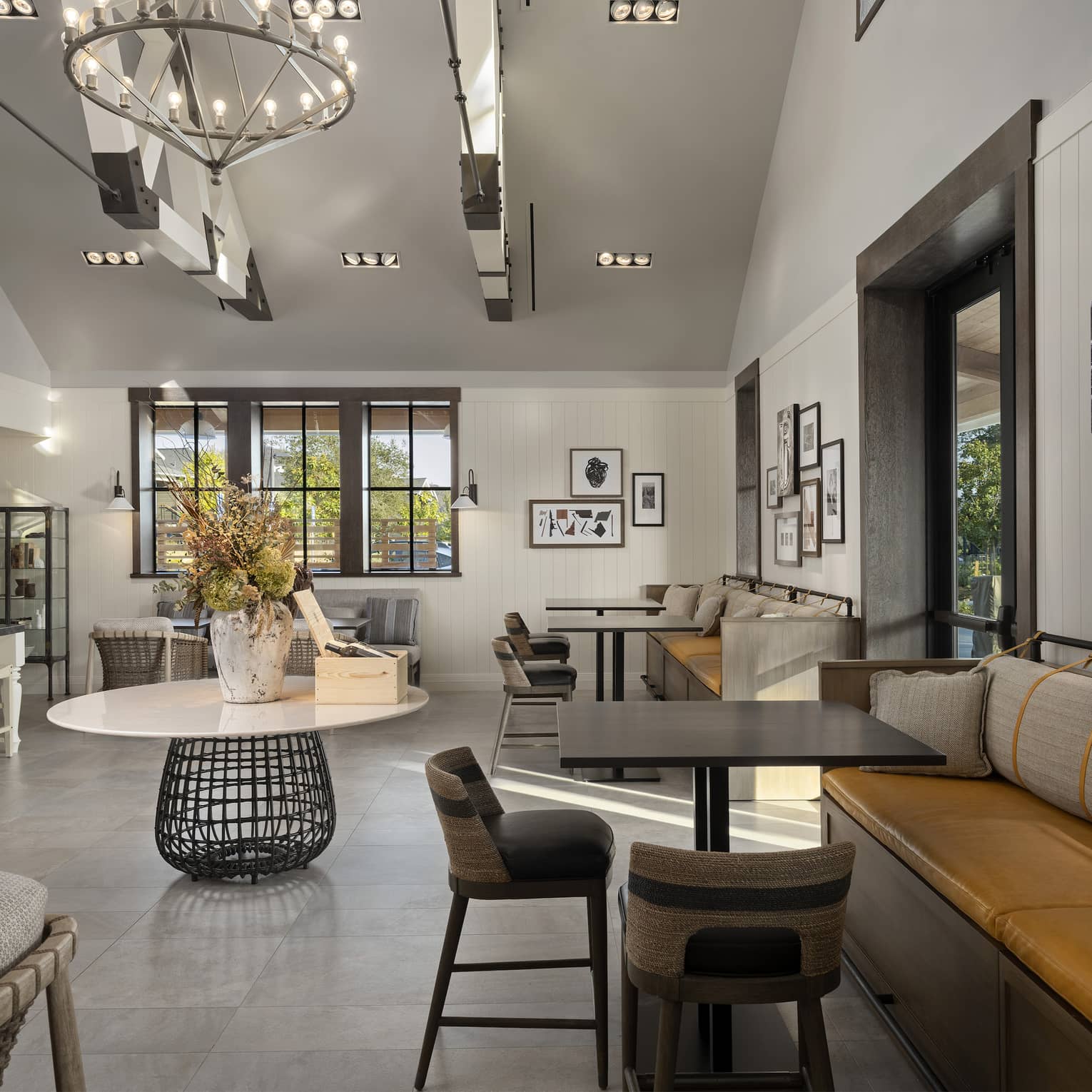 A large room with many seats and an eclectic style.