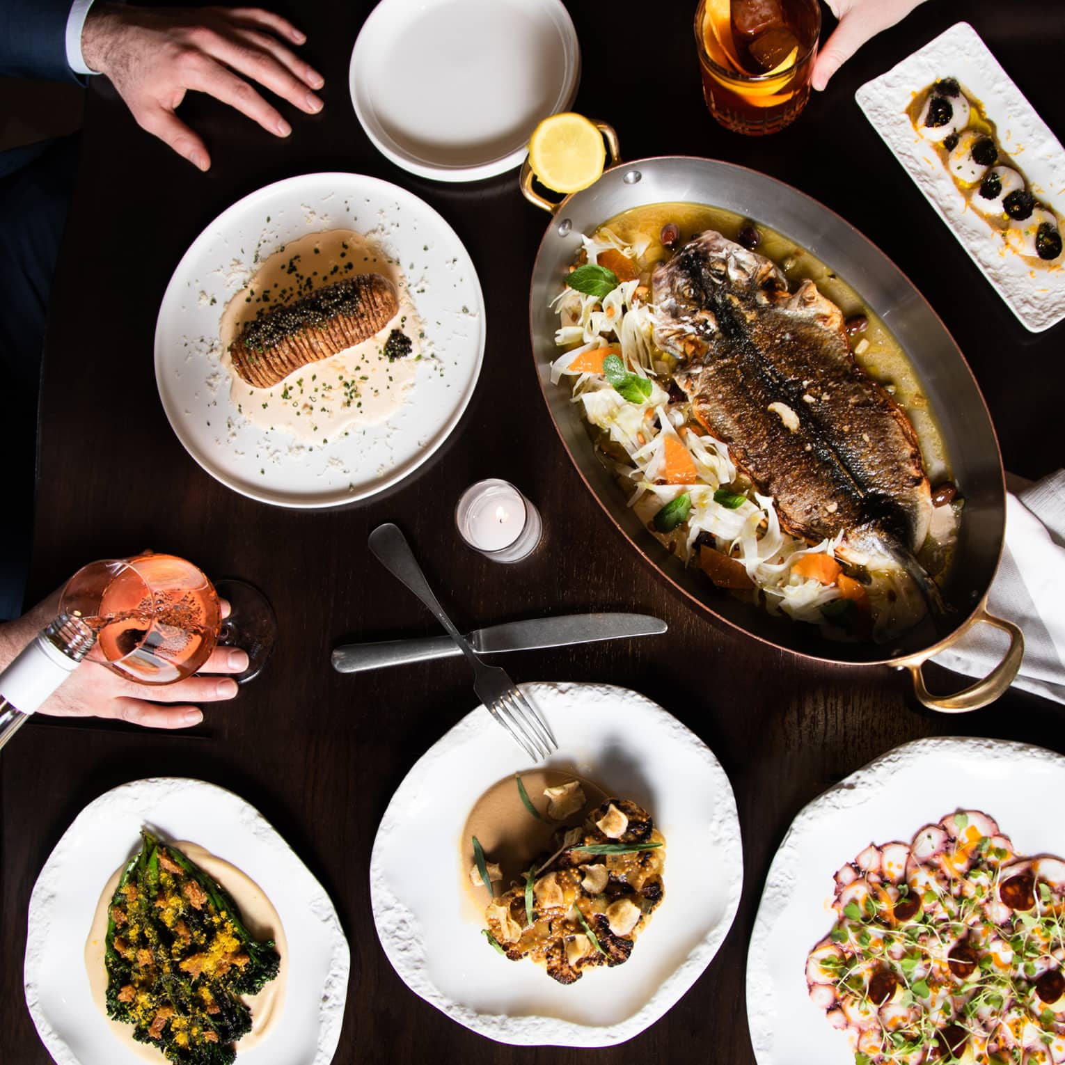An assortment seafood on white plates.