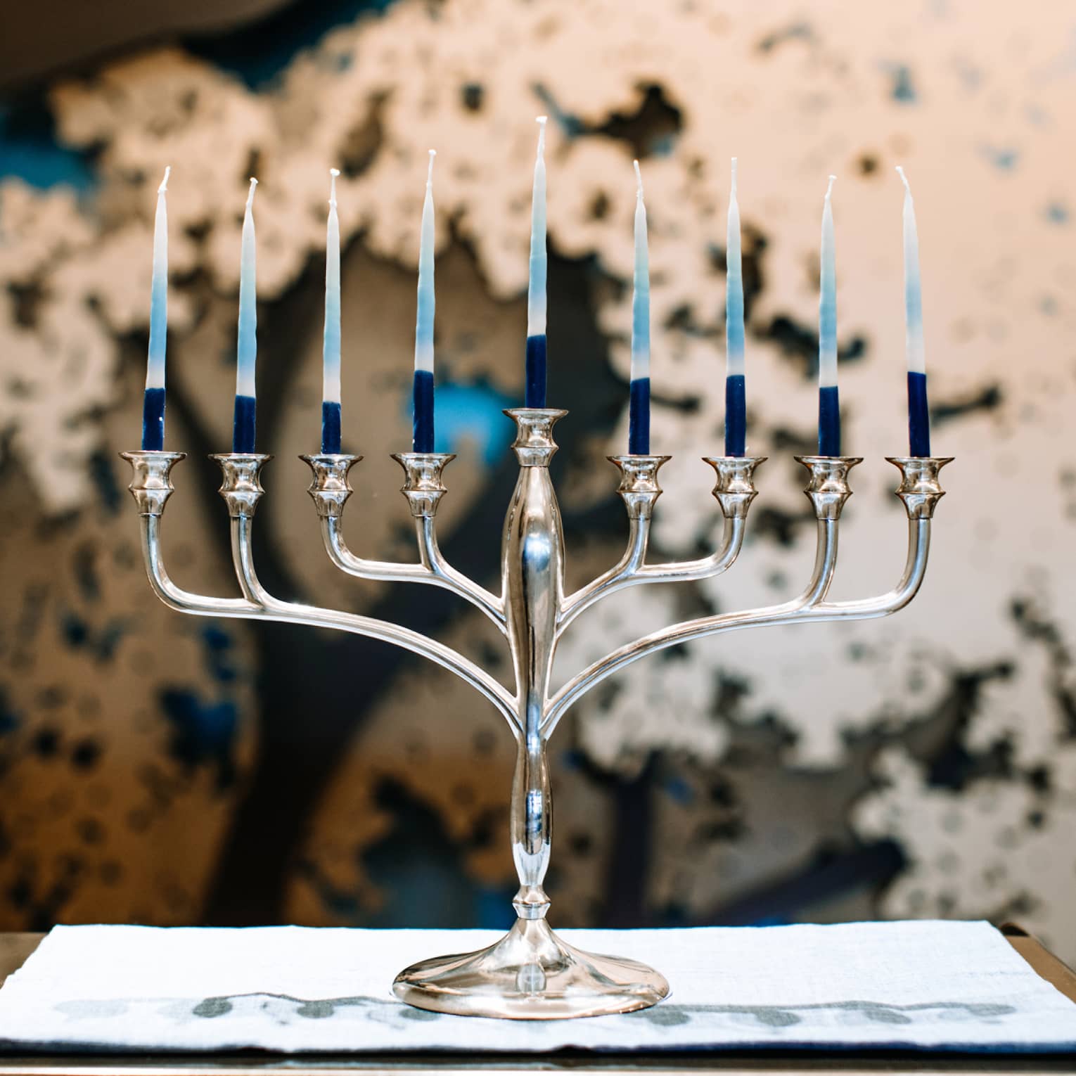 A silver menorah with 9 candles.