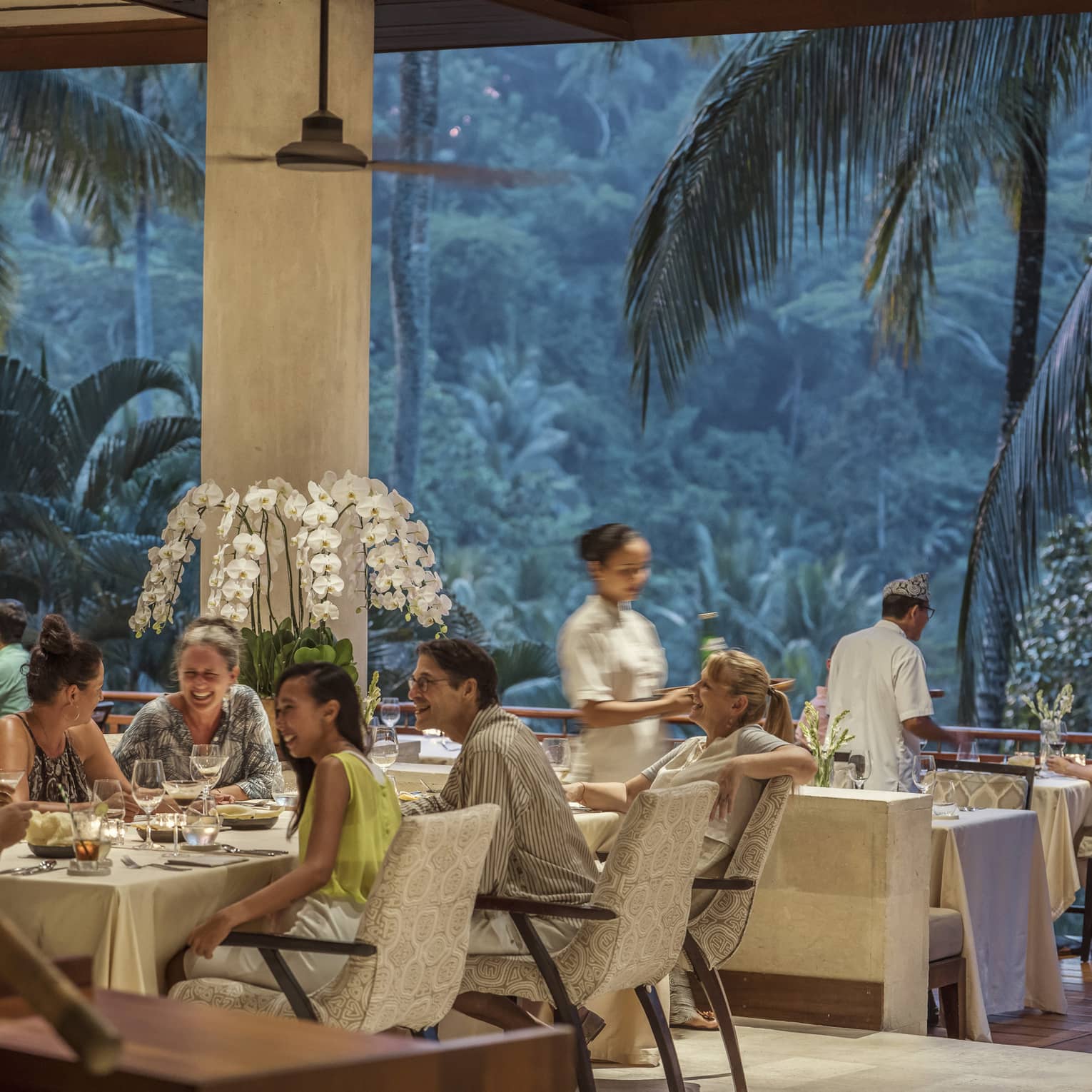 Ayung Terrace open air restaurant dining room surrounded by large palms