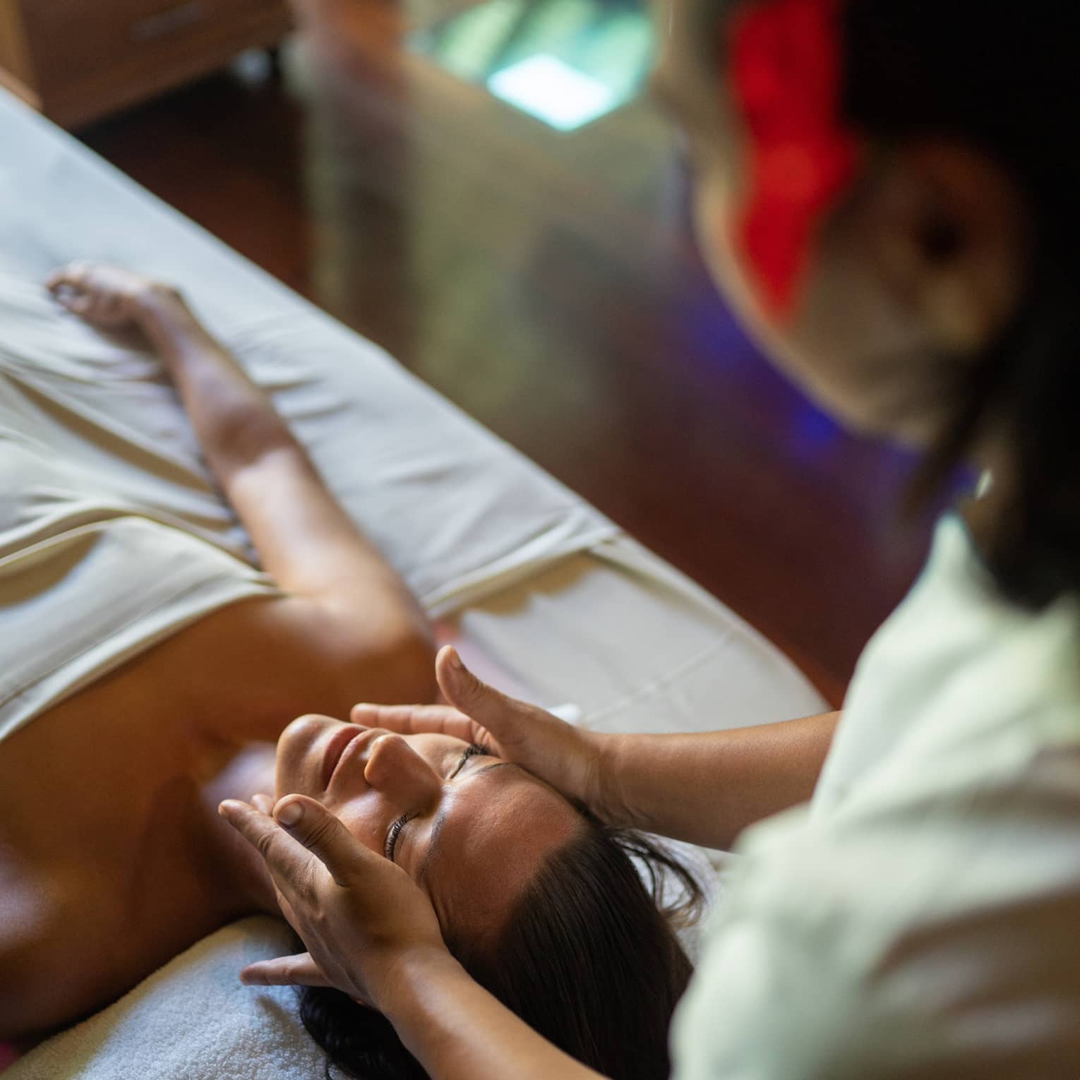 Female guest enjoys a facial at Te Mahana Spa