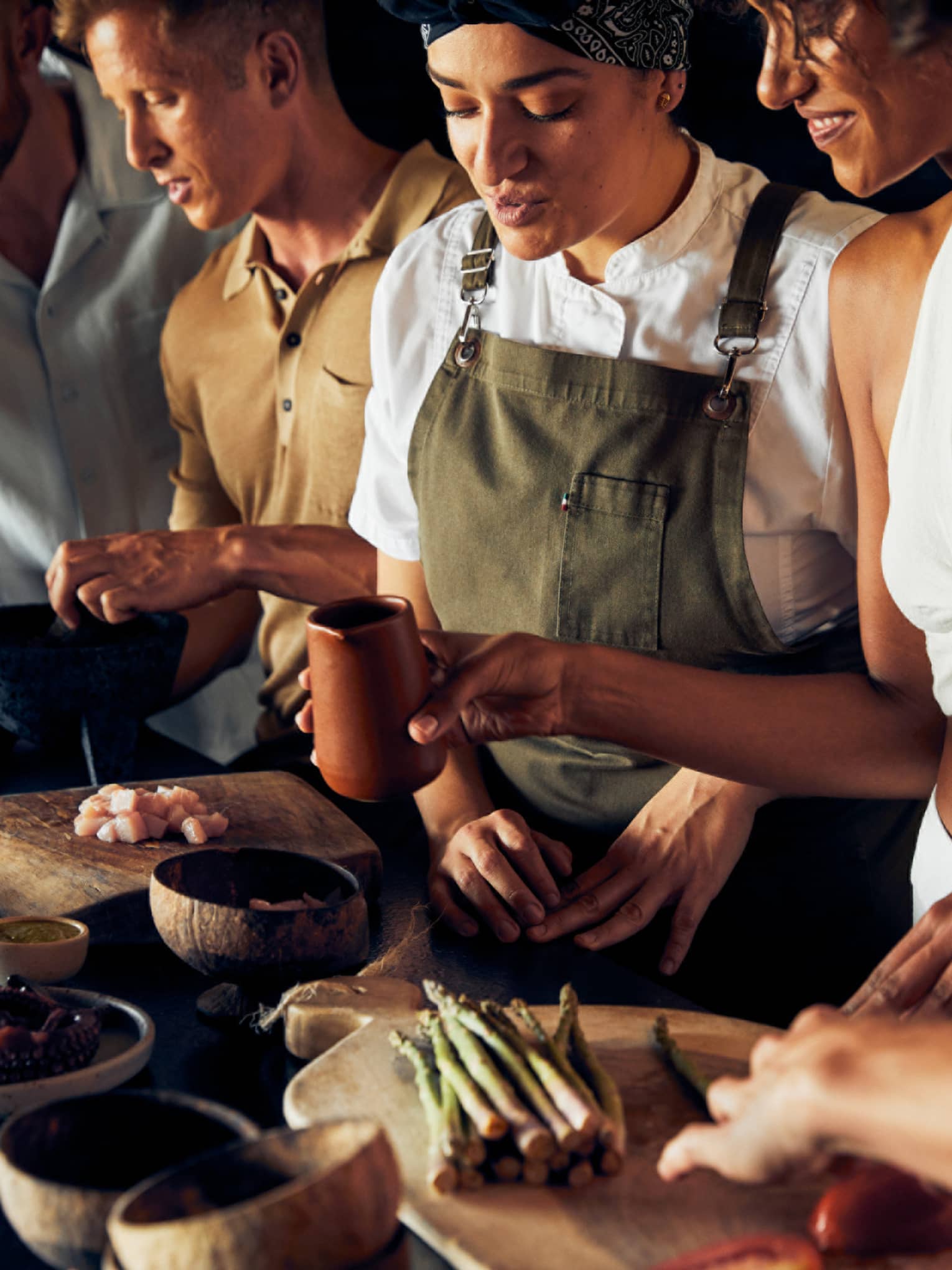 A group of people cooking food.