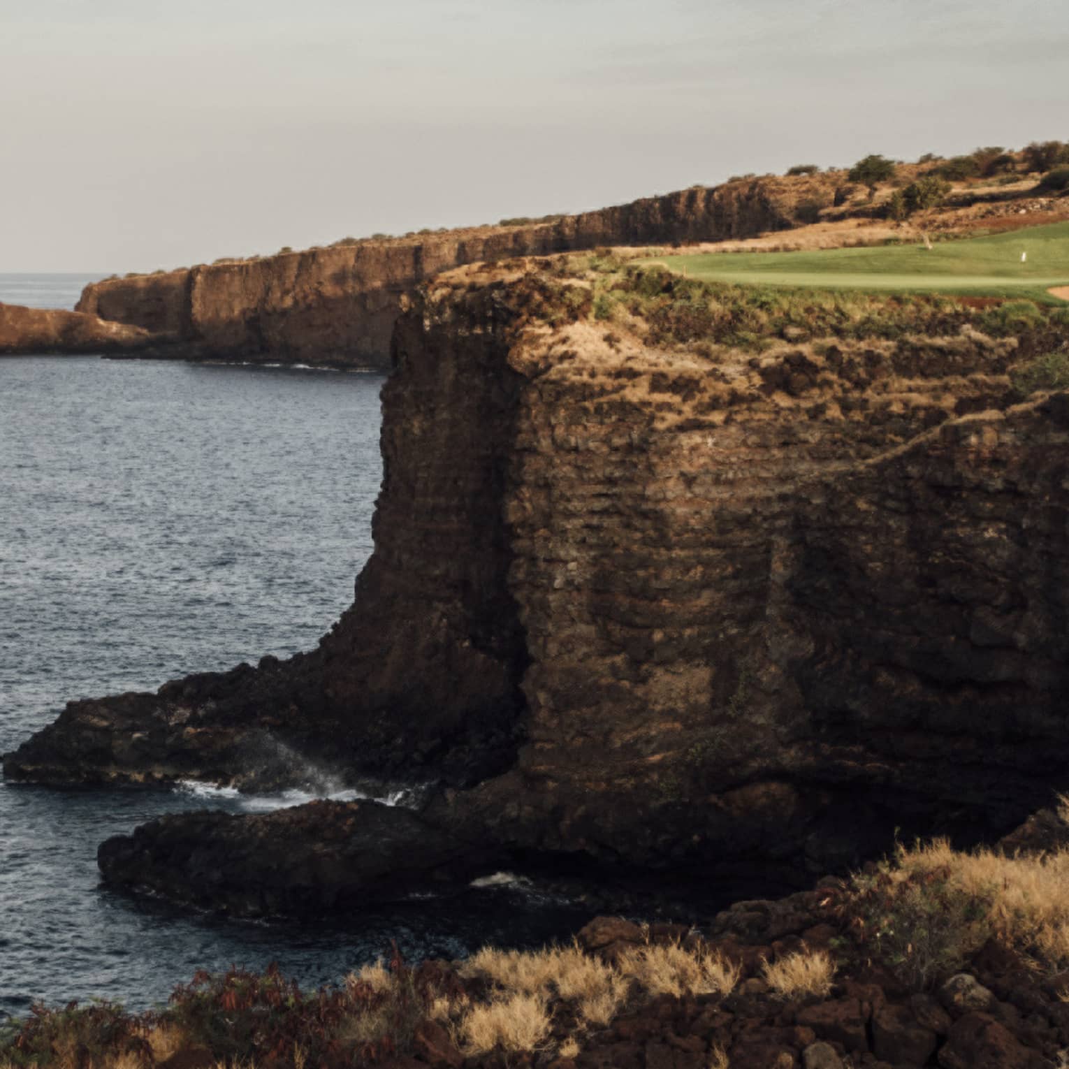 Golf course at Four Seasons Resort Lanai, cliffside along the ocean