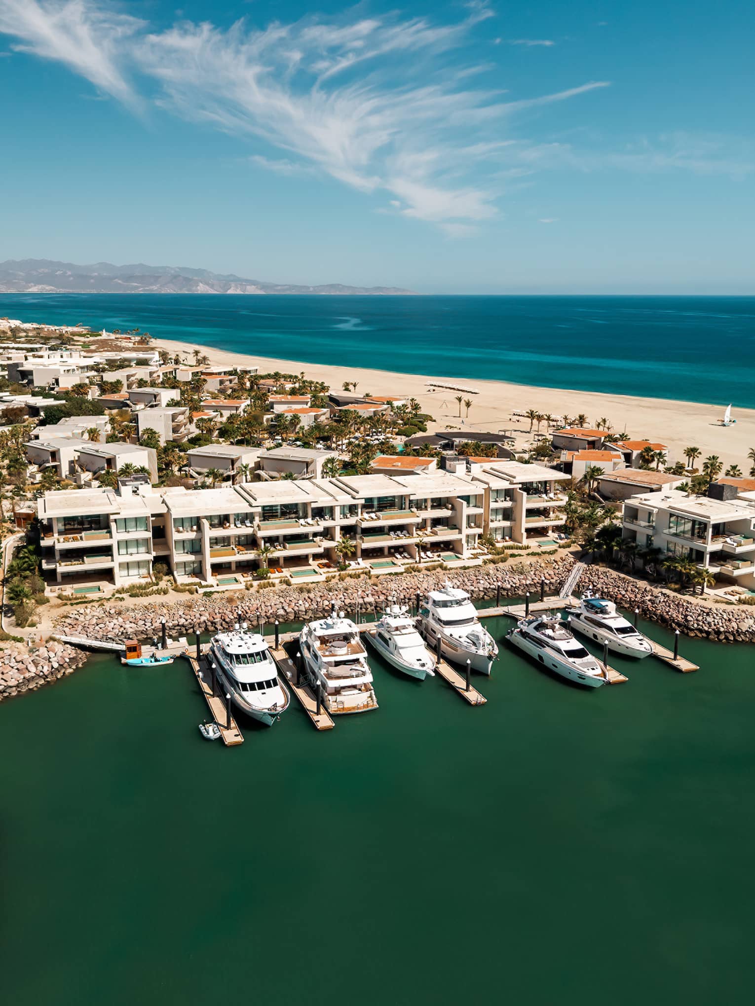 Aerial view of marina and beach in the distance