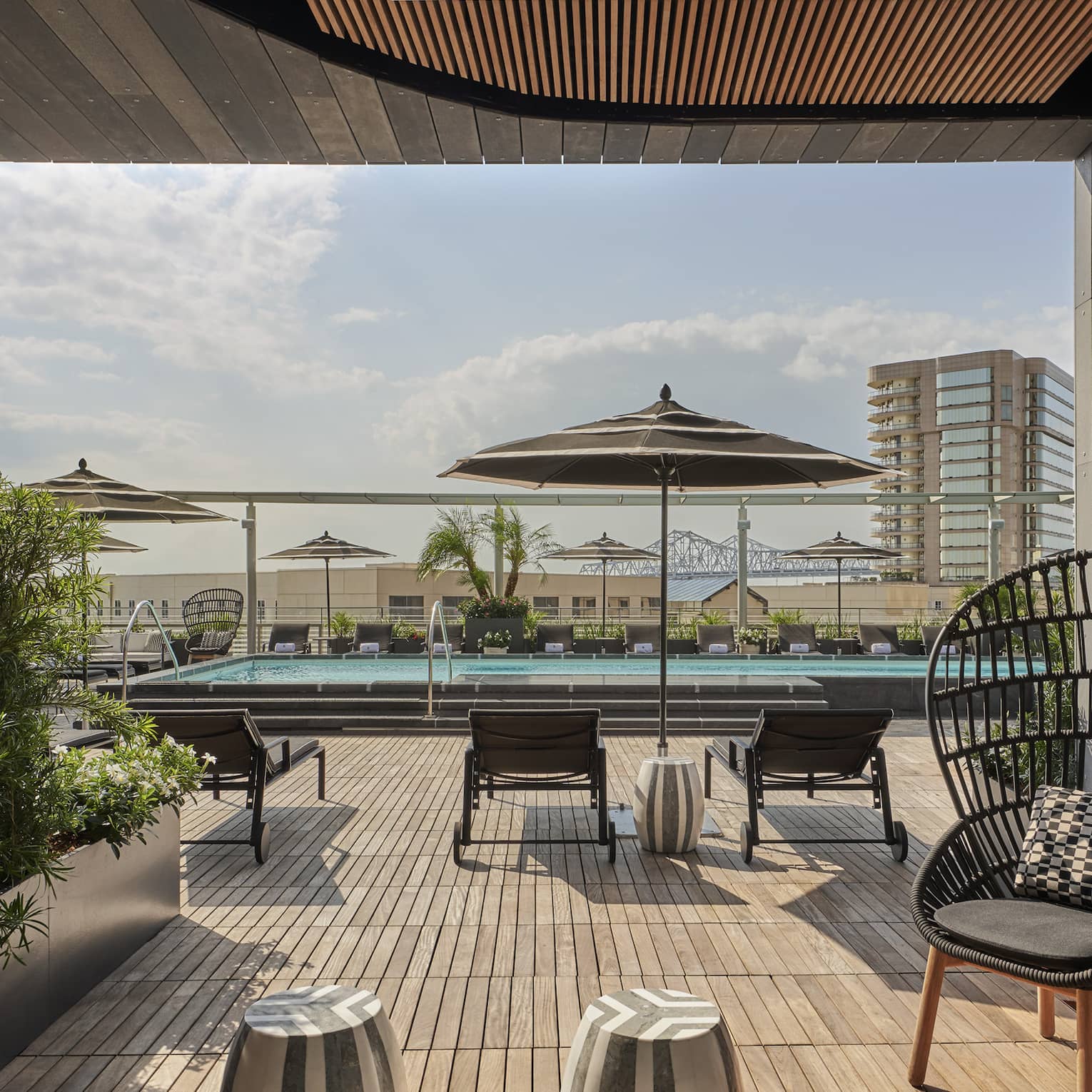 A cabana near an outdoor pool.