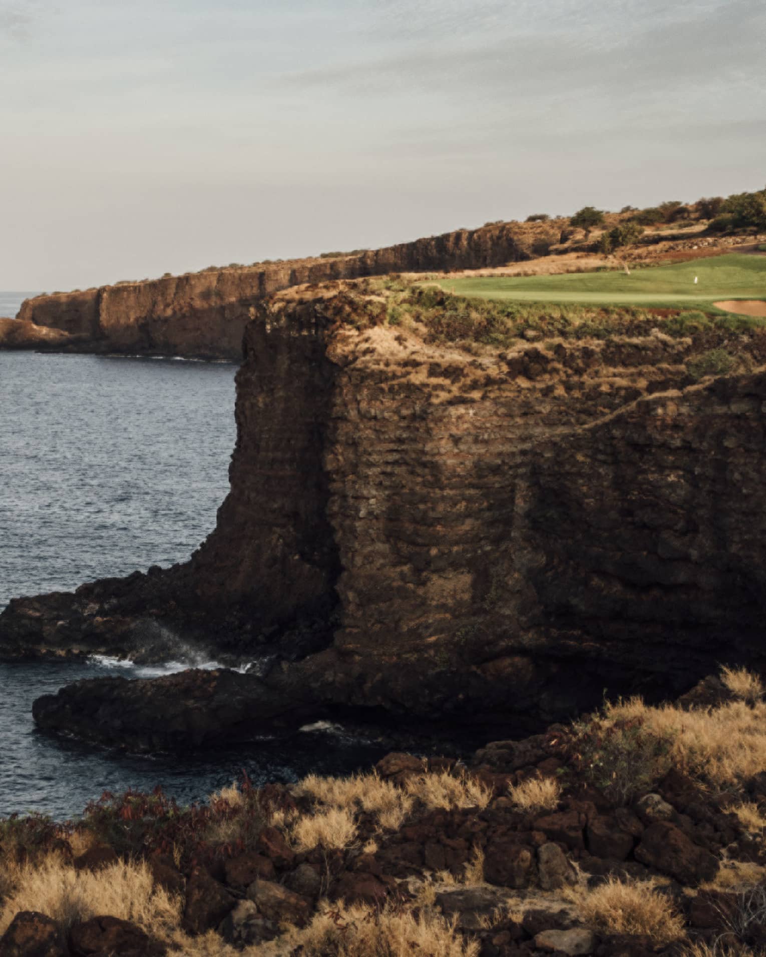 Golf course at Four Seasons Resort Lanai, cliffside along the ocean