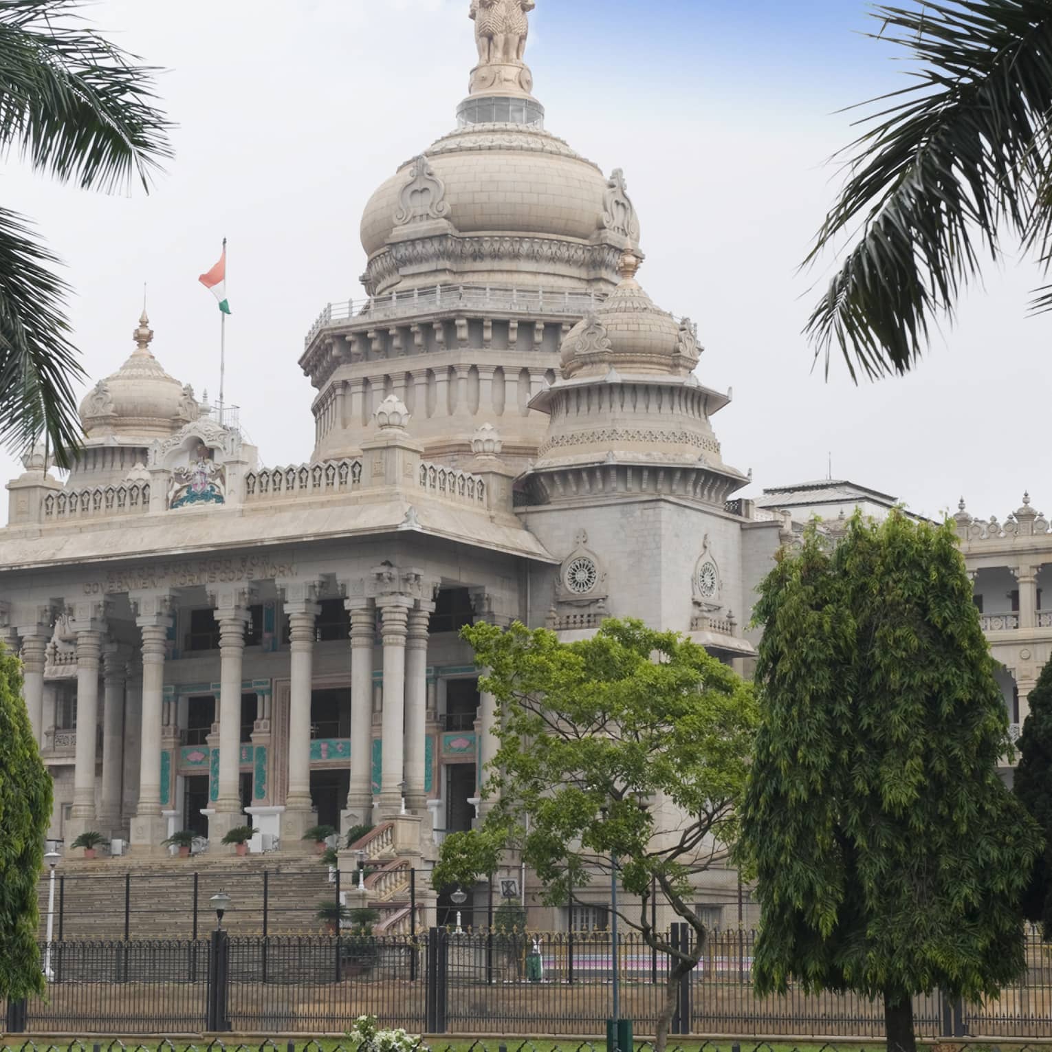 Palm trees in front of Vidhana Soudha government building exterior
