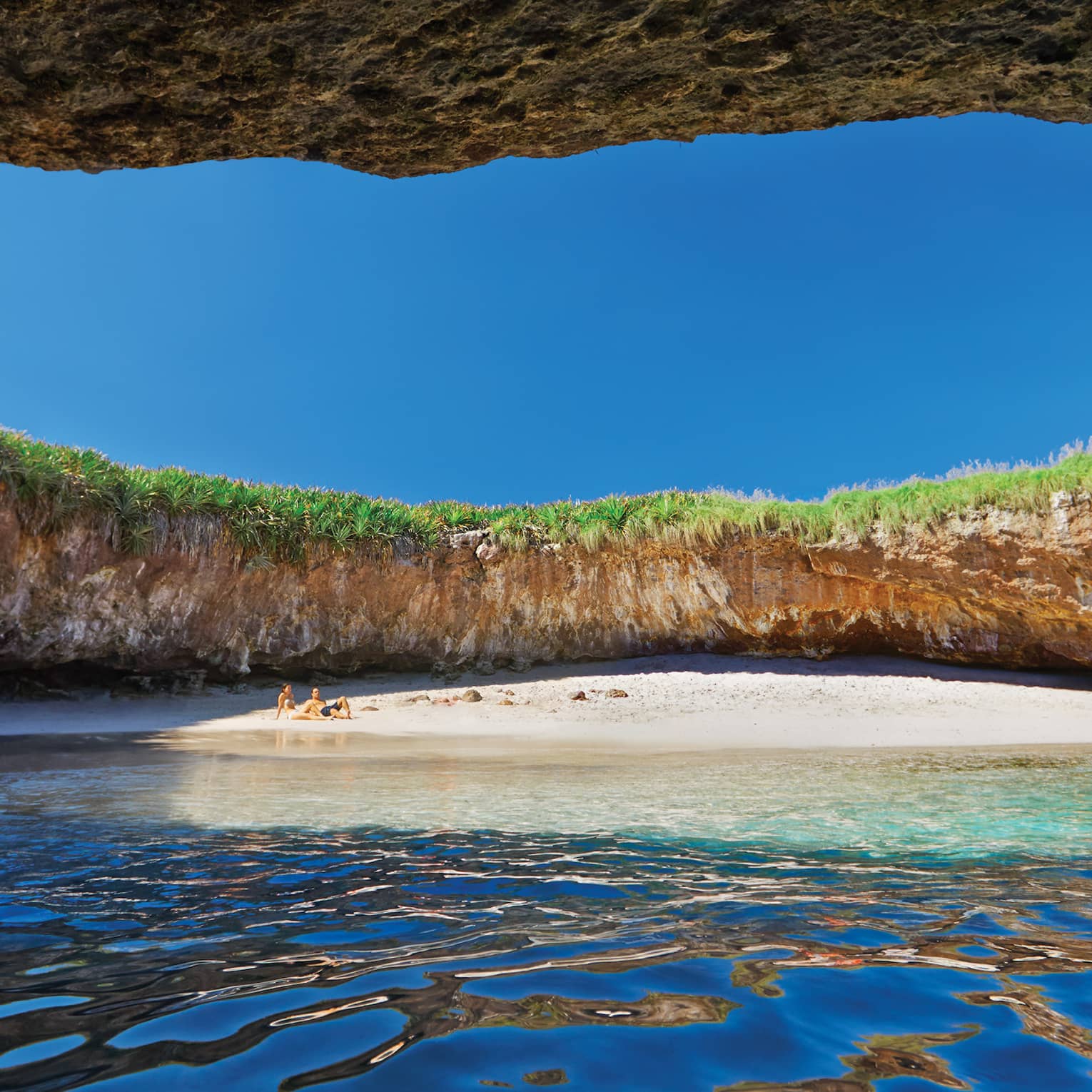 Hidden beach under opening in Marietas Islands cave