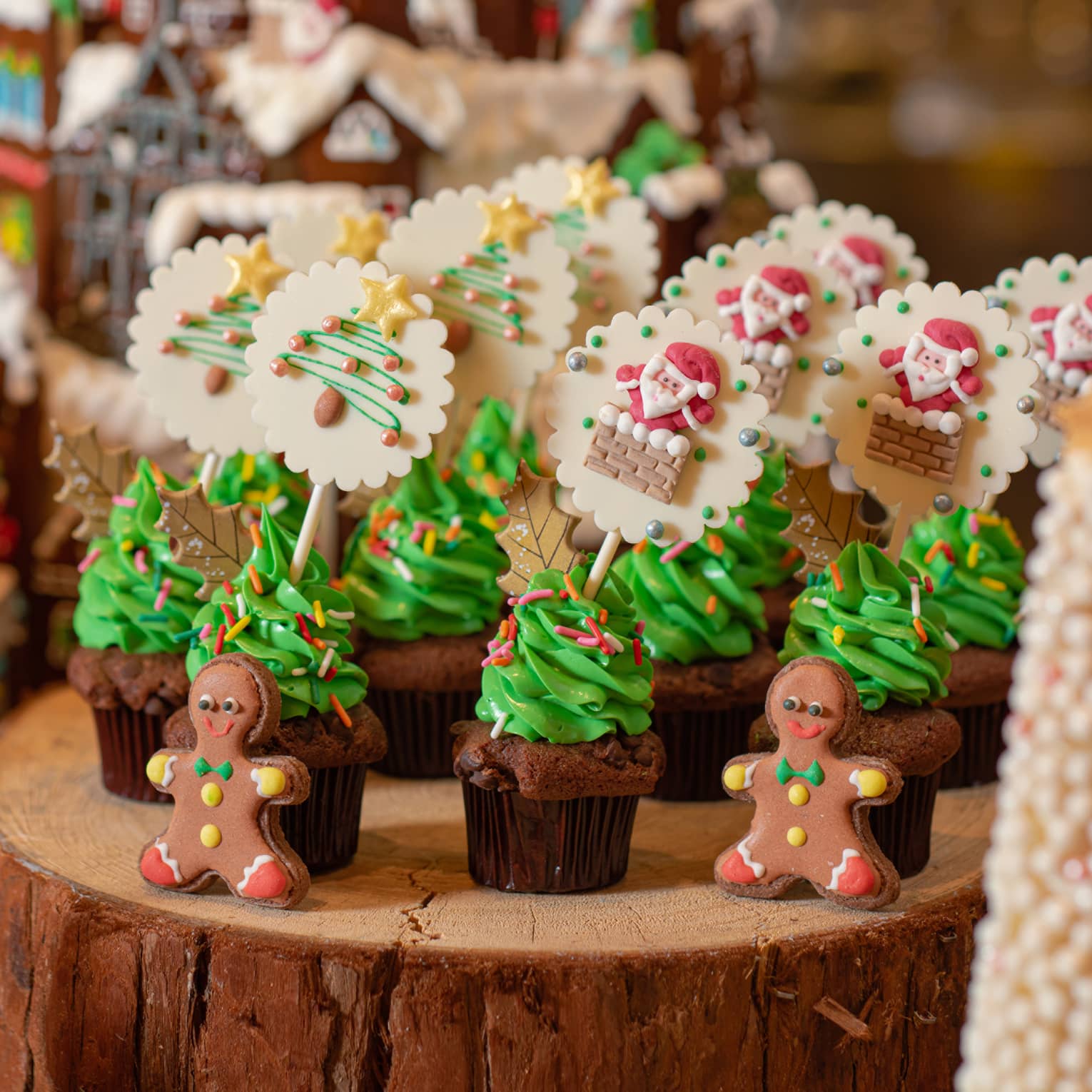 Various Christmas confections lined up on a log