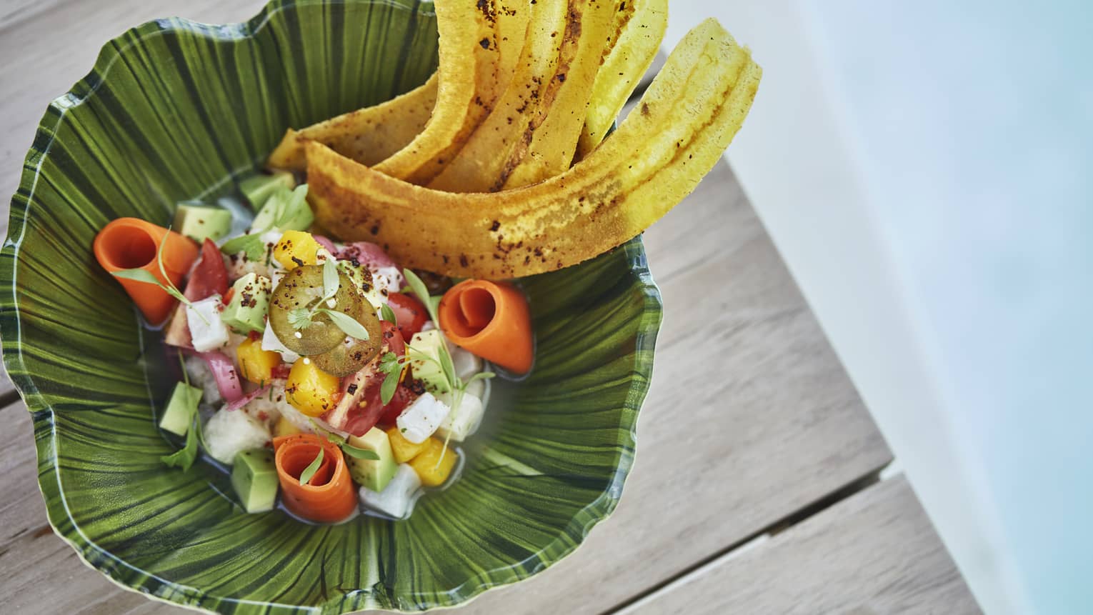 Poolside dining. View of tropical dish snapper ceviche with Florida mango