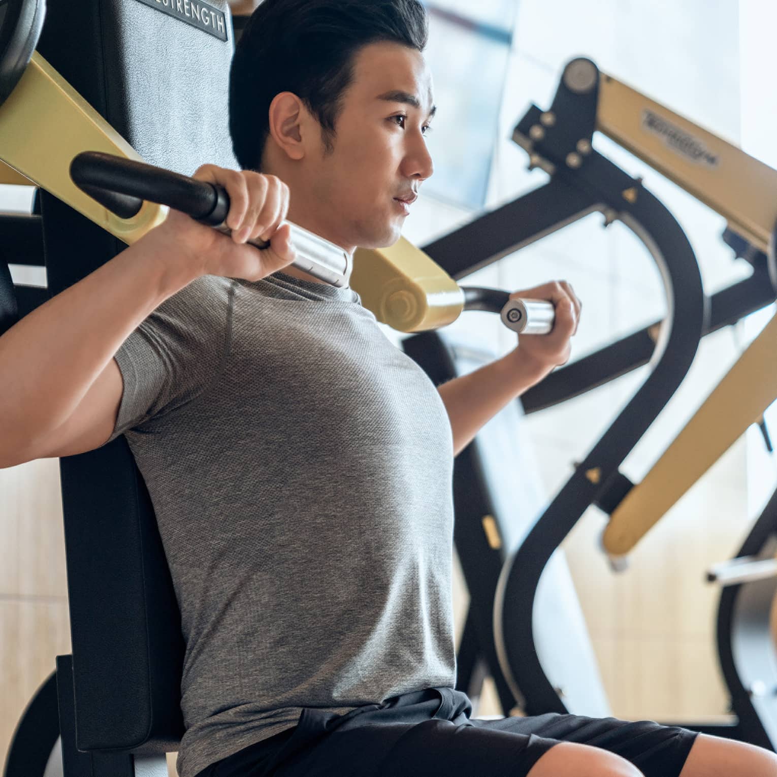 Guest using fitness equipment in gym at Four Seasons