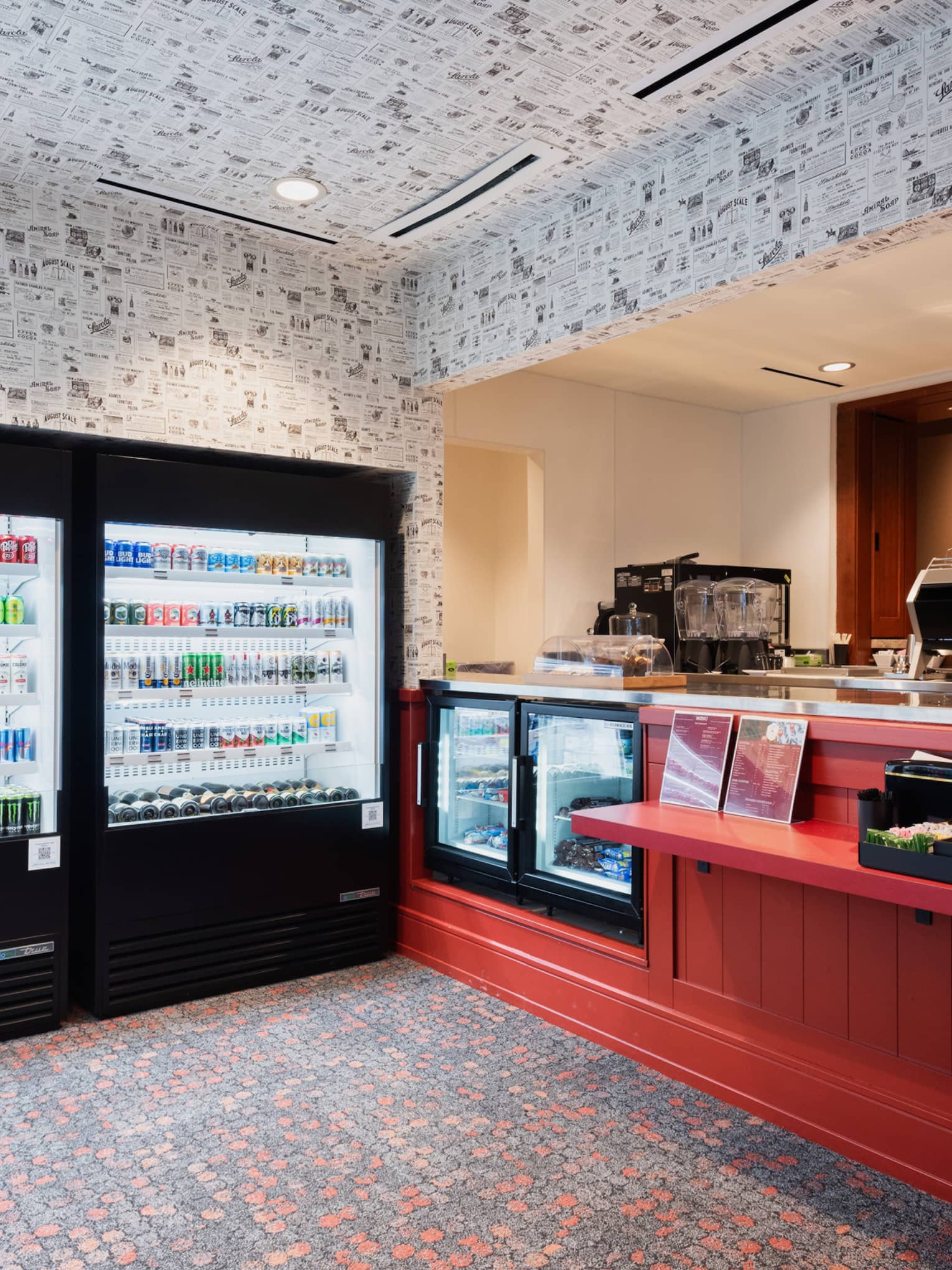 A grab-and-go takeaway counter with two cooler walls of drinks at Four Seasons Resort Jackson Hole