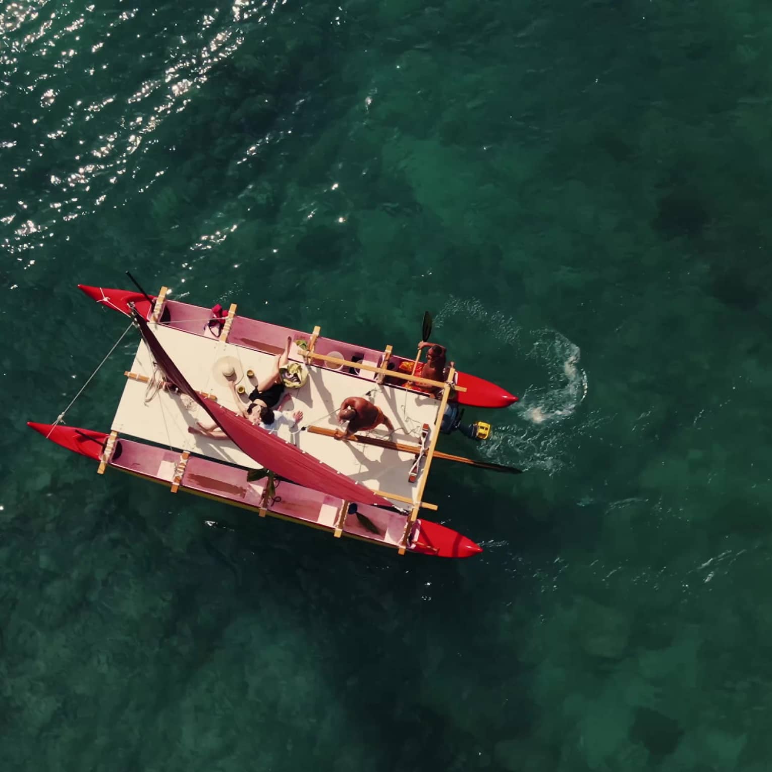 Aerial view of a Hawaiian double hull canoe on the water