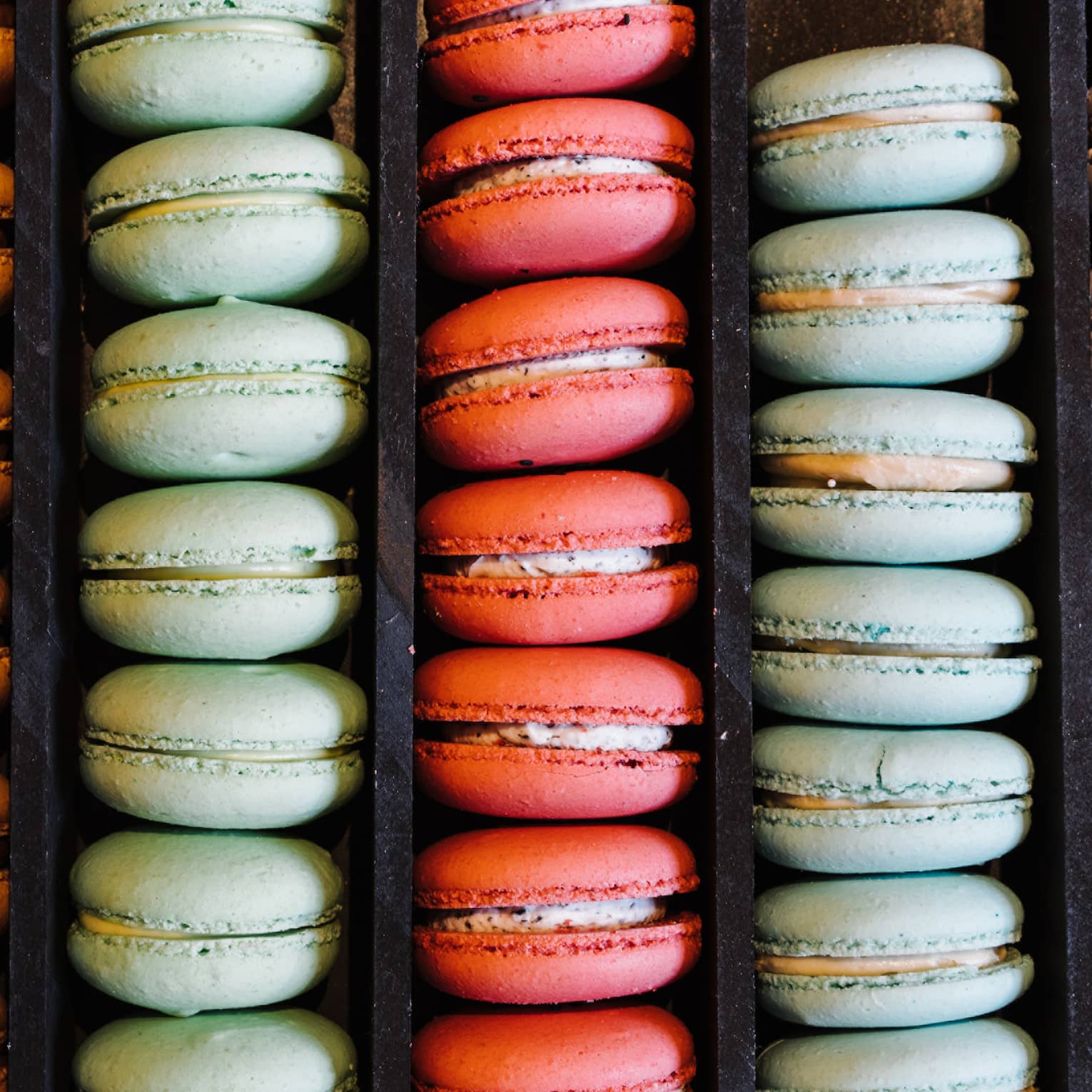 Rows of colourful macaron desserts