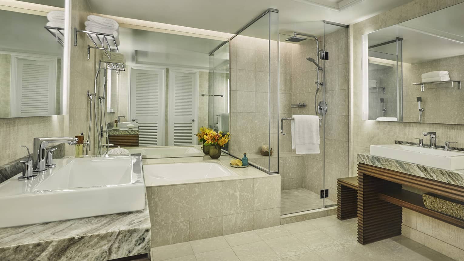 bright bathroom with bath, shower and two wash basins