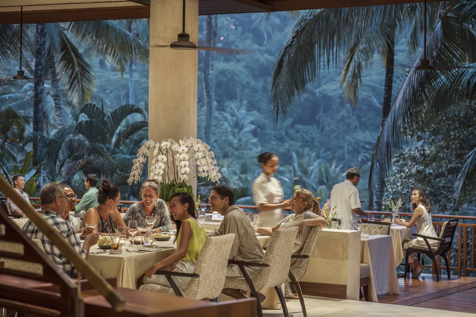 Ayung Terrace open air restaurant dining room surrounded by large palms