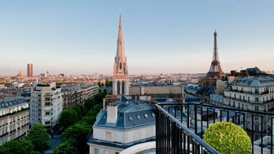 View over Paris rooftops, cathedral towers, Eiffel Tower