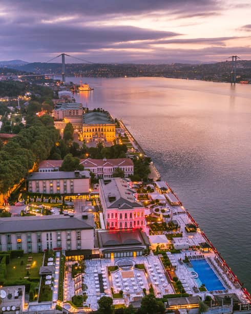 Riverfront Istanbul Hotel building illuminated at dusk