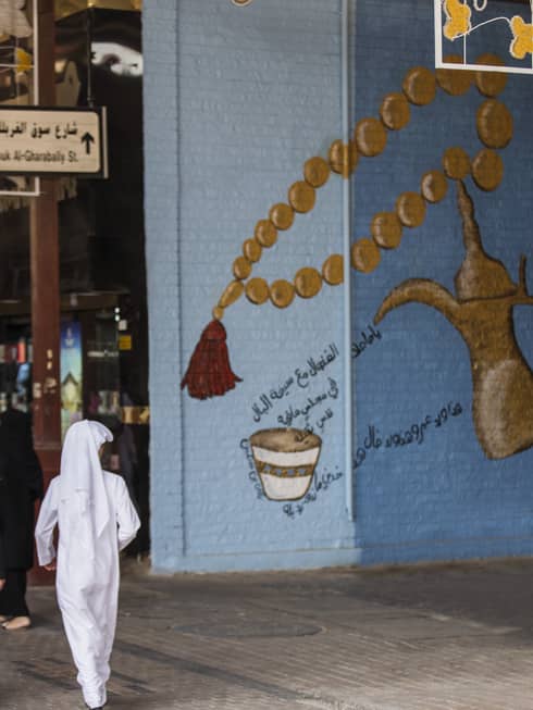 Man walking into Kuwaiti souq