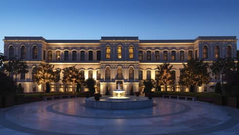 Four Seasons hotel Istanbul at the Bosphorus building exterior, fountain with lights at dusk