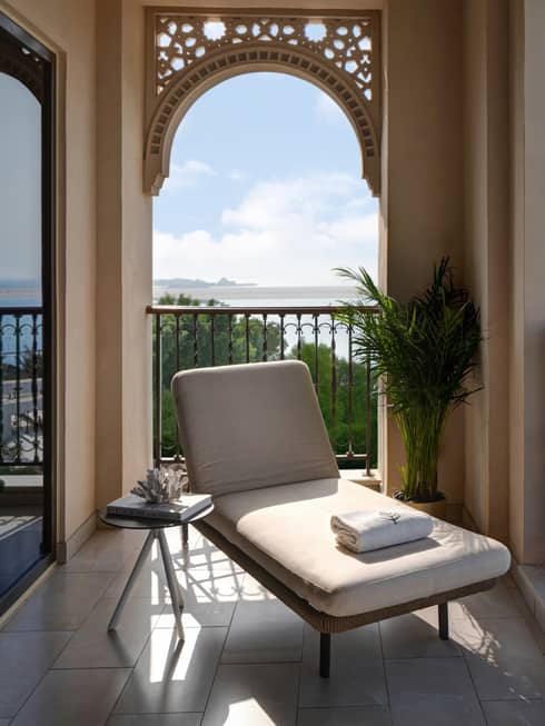 Balcony with lounge chair and sea view