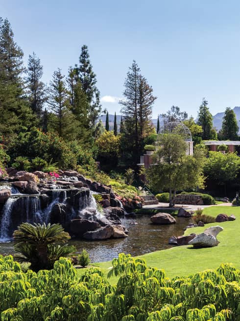 Waterfalls over rocks, boulders in garden at Four Seasons Hotel Westlake Village
