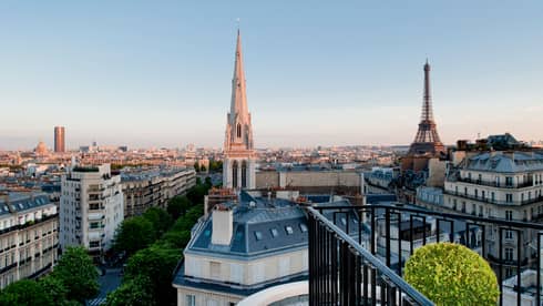 View over Paris rooftops, cathedral towers, Eiffel Tower