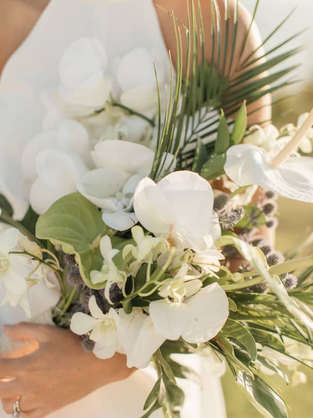 Close up of a bride holding a floral bouquet