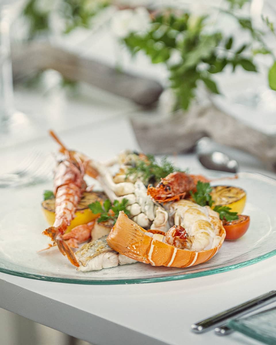 Dining table set, with seafood dish plated