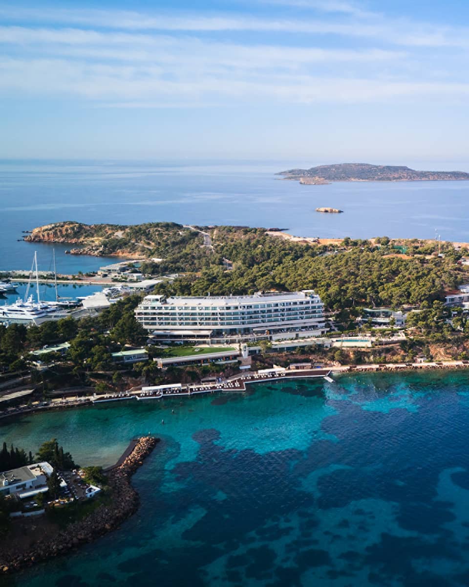 Aerial view of resort on a peninsula surrounded by blue sea