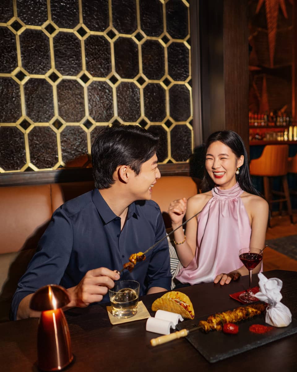 Man and woman enjoying a meal in Harbour Bar